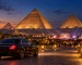 Illustration of an evening concert near the Pyramids of Giza with a private transfer car in the foreground