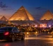 Illustration of an evening concert near the Pyramids of Giza with a private transfer car in the foreground
